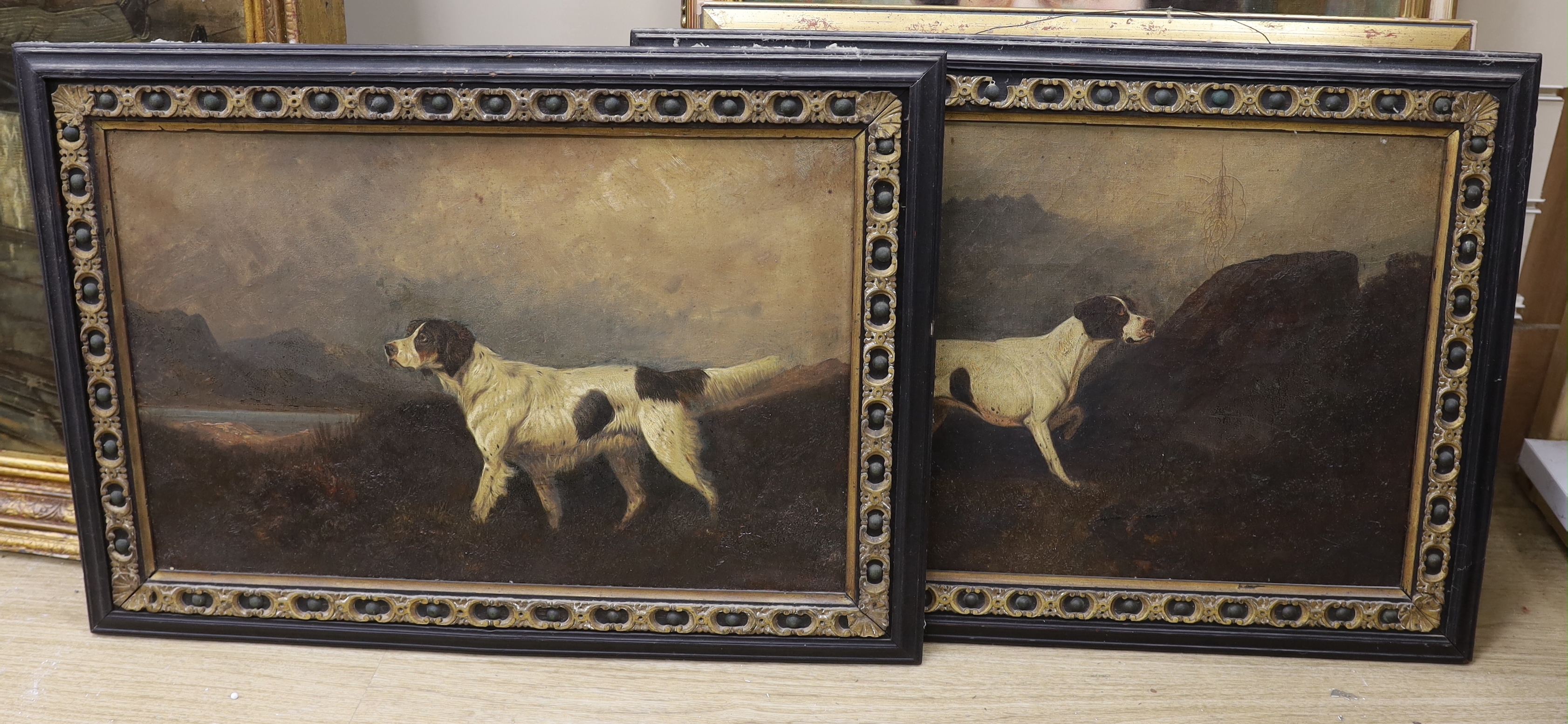 19th century English School, pair of oils on canvas, Gundogs before landscapes, unsigned, 34 x 51cm, housed in ebonised frames